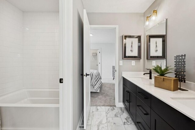 20090 63rd Ave, Corcoran, MN 55340 - bathroom featuring marble finish flooring, double vanity, baseboards, and shower / washtub combination