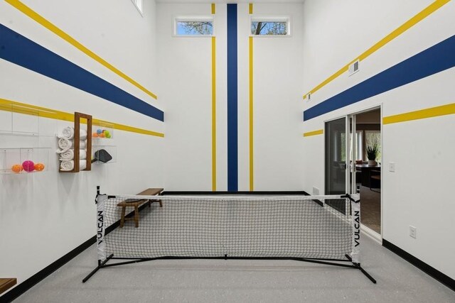 20090 63rd Ave, Corcoran, MN 55340 - workout area with baseboards, healthy amount of natural light, and a towering ceiling