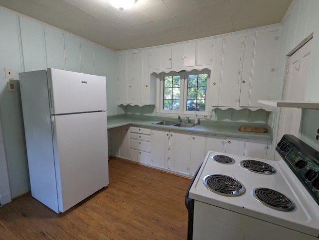 5253 Bald Eagle Blvd, White Bear Twp, MN 55110 - kitchen with white appliances, a sink, white cabinets, light countertops, and wood finished floors