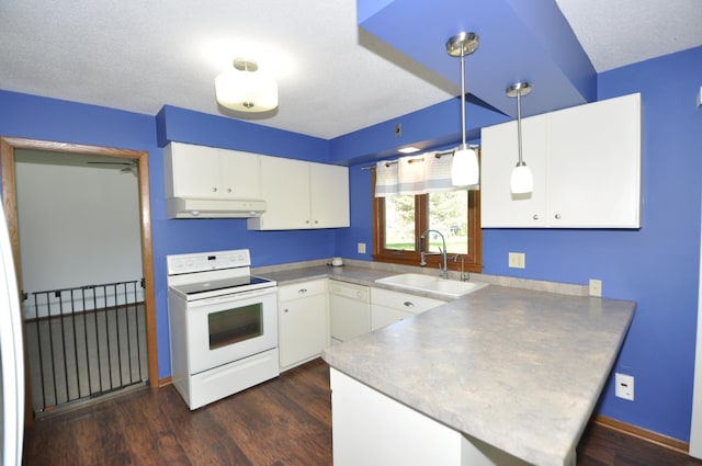 kitchen featuring white appliances, a sink, under cabinet range hood, a peninsula, and white cabinets