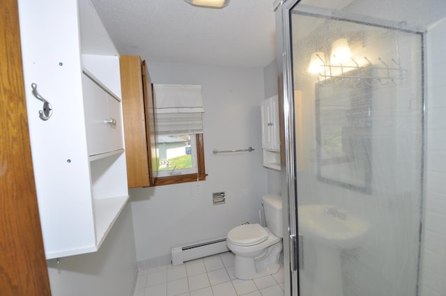 bathroom with baseboard heating, tile patterned floors, a shower stall, toilet, and baseboards