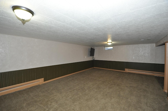 669 14th St, Saint Charles, MN 55972 - finished below grade area featuring carpet and a baseboard heating unit