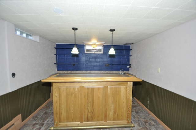 669 14th St, Saint Charles, MN 55972 - bar featuring indoor bar, wood walls, a wainscoted wall, and decorative light fixtures