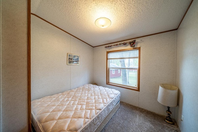 29501 Maplewood Rd Autumn, Unit Autumn, Callaway, MN 56521 - bedroom with a textured ceiling, carpet floors, vaulted ceiling, and crown molding