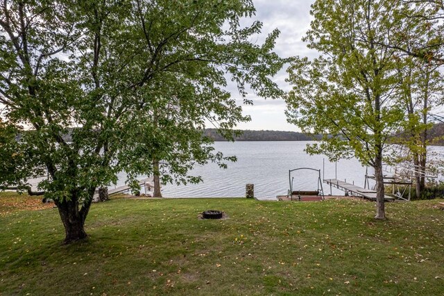 29501 Maplewood Rd Autumn, Unit Autumn, Callaway, MN 56521 - view of green lawn featuring a water view and a dock