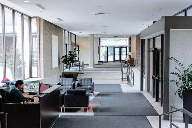 community lobby with a wall of windows
