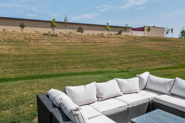 view of green lawn with outdoor lounge area
