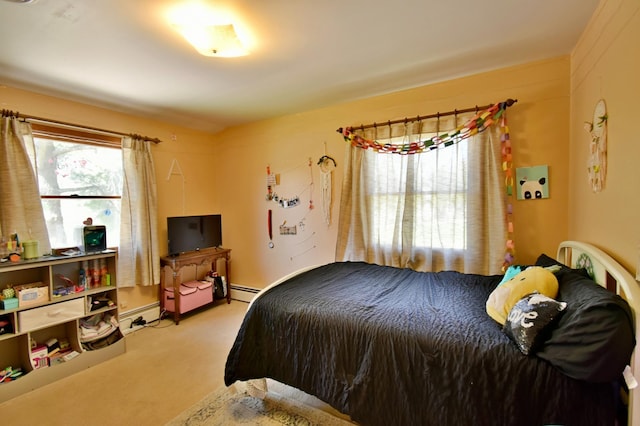 carpeted bedroom featuring a baseboard radiator