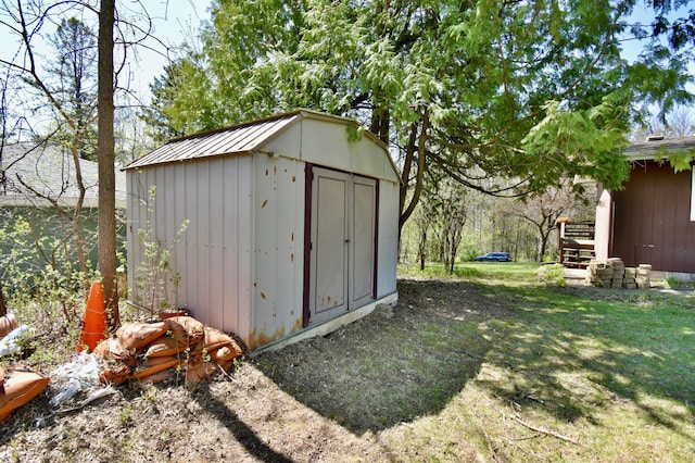 view of shed with stairs