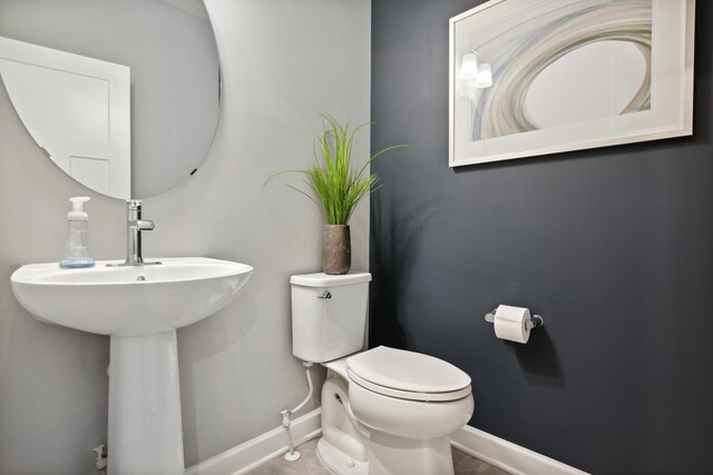 15056 Sycamore St NW, Andover, MN 55304 - bathroom with baseboards and toilet