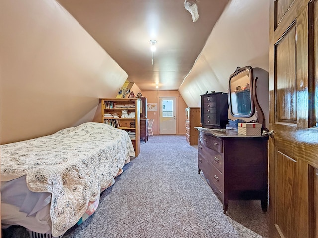 carpeted bedroom with lofted ceiling