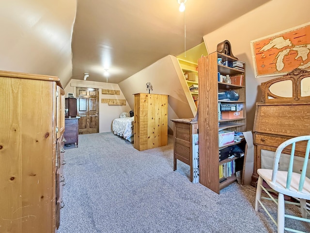 bedroom featuring carpet flooring and vaulted ceiling