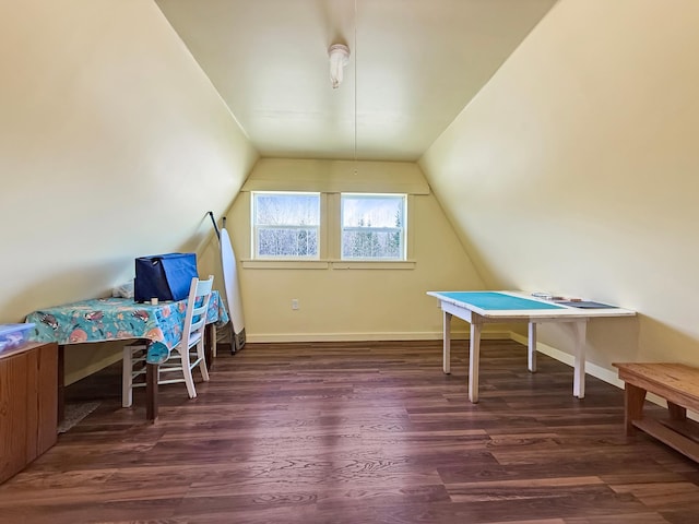 rec room featuring dark wood-style floors, vaulted ceiling, and baseboards