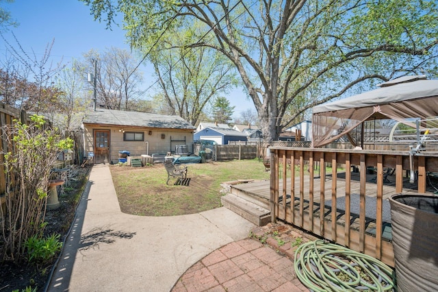 5748 25th Ave S, Minneapolis, MN 55417 - view of yard with a wooden deck and a fenced backyard