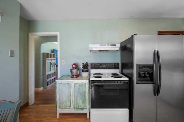 5748 25th Ave S, Minneapolis, MN 55417 - kitchen with stainless steel fridge, under cabinet range hood, white range with electric cooktop, and wood finished floors
