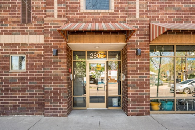 2803 38th St Unit 205, Minneapolis, MN 55406 - doorway to property featuring brick siding
