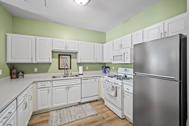 2803 38th St Unit 205, Minneapolis, MN 55406 - kitchen featuring white appliances, a sink, and white cabinets