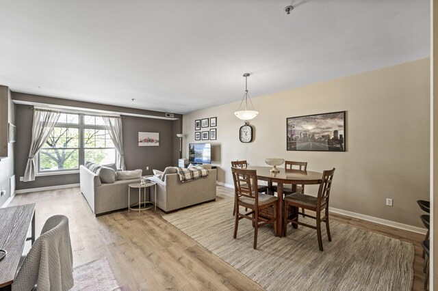 2803 38th St Unit 205, Minneapolis, MN 55406 - dining room with light wood finished floors and baseboards