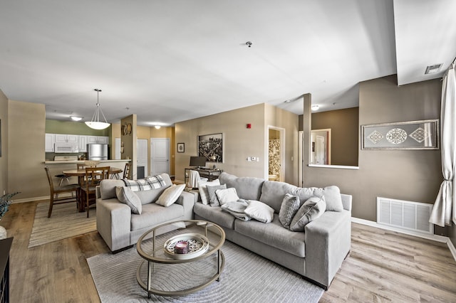 2803 38th St Unit 205, Minneapolis, MN 55406 - living area featuring wood finished floors and baseboards