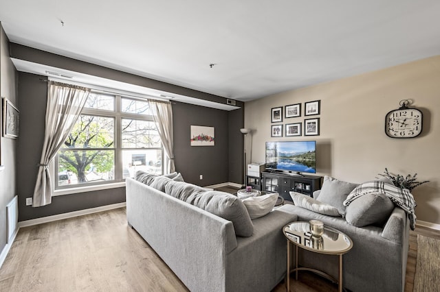 2803 38th St Unit 205, Minneapolis, MN 55406 - living area featuring light wood finished floors and baseboards