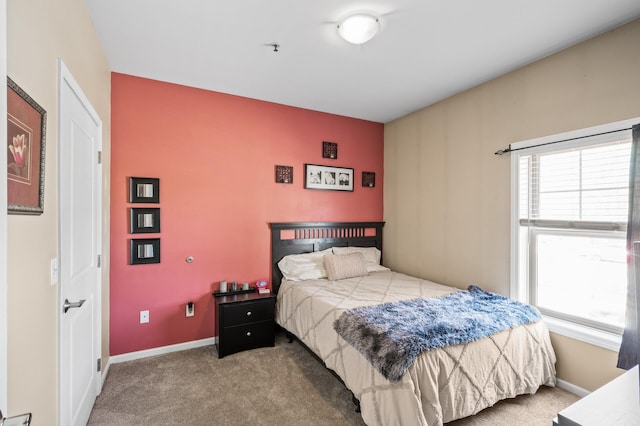 2803 38th St Unit 205, Minneapolis, MN 55406 - bedroom featuring multiple windows, carpet floors, and baseboards