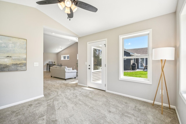 20074 Fitzgerald Trl N, Forest Lake, MN 55025 - carpeted spare room with lofted ceiling, a ceiling fan, and baseboards