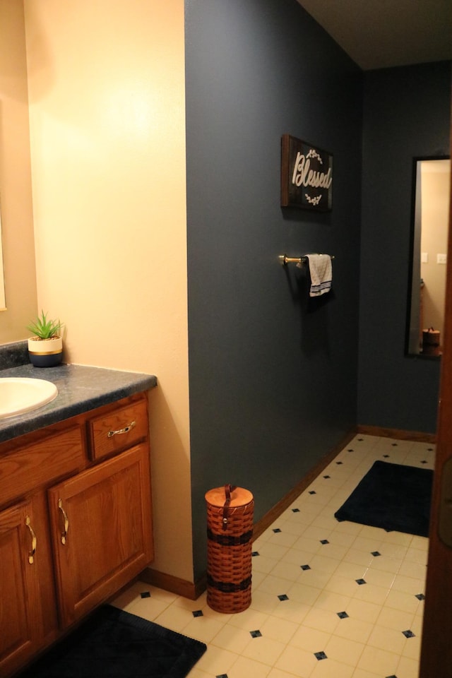 bathroom featuring vanity and baseboards