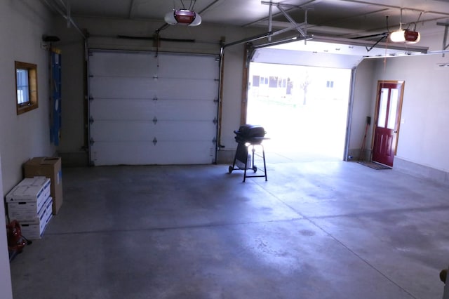 garage featuring a garage door opener