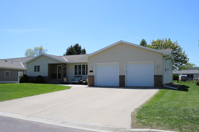 single story home with a garage, brick siding, concrete driveway, and a front lawn