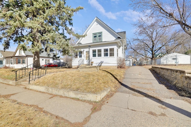 bungalow-style home featuring a front yard