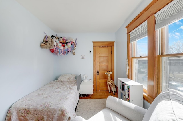 bedroom with wood finished floors