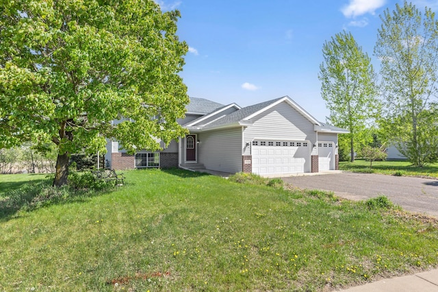 7724 385th St, North Branch, MN 55056 - view of front facade featuring an attached garage, brick siding, a front lawn, asphalt driveway, and roof with shingles