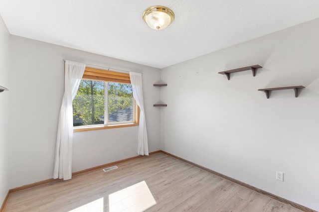7724 385th St, North Branch, MN 55056 - unfurnished room featuring light wood-style flooring and baseboards
