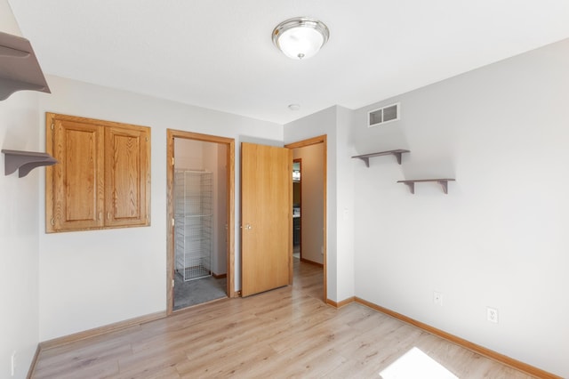 7724 385th St, North Branch, MN 55056 - unfurnished bedroom featuring light wood finished floors and baseboards