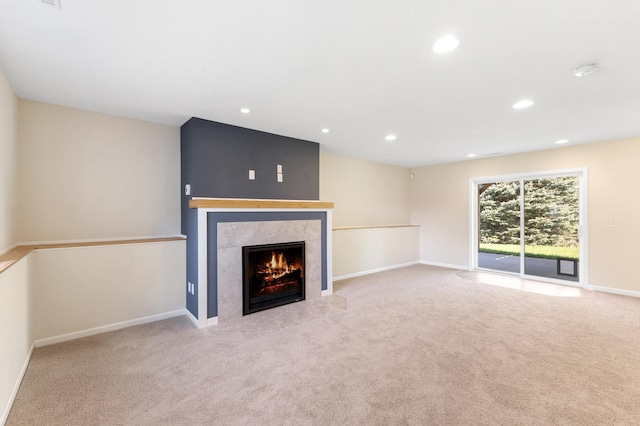 7724 385th St, North Branch, MN 55056 - unfurnished living room featuring a tile fireplace, recessed lighting, carpet flooring, and baseboards