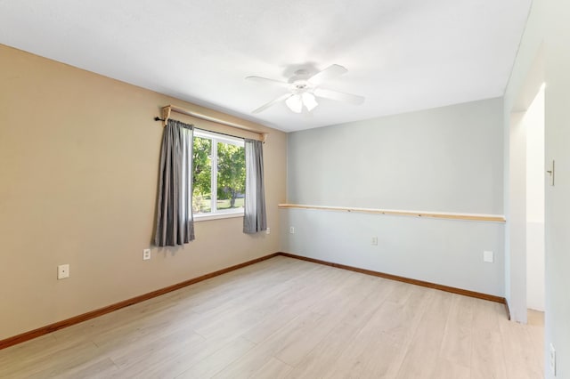 7724 385th St, North Branch, MN 55056 - spare room with a ceiling fan, light wood-style flooring, and baseboards