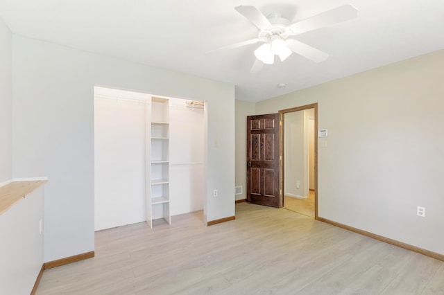 7724 385th St, North Branch, MN 55056 - unfurnished bedroom featuring light wood-style floors, baseboards, a closet, and a ceiling fan