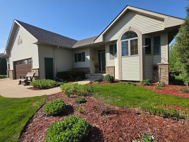1073 Harvest Way, Lake City, MN 55041 - view of front of property featuring brick siding, an attached garage, a front lawn, and a shingled roof