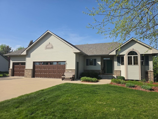 1073 Harvest Way, Lake City, MN 55041 - single story home featuring a front lawn, concrete driveway, a garage, entry steps, and brick siding