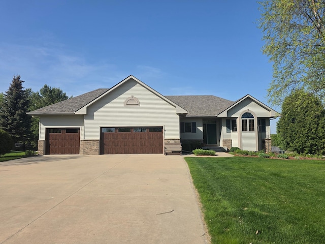 1073 Harvest Way, Lake City, MN 55041 - view of front facade with an attached garage, concrete driveway, a front lawn, and roof with shingles