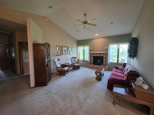 1073 Harvest Way, Lake City, MN 55041 - living area with light carpet, ceiling fan, a fireplace, vaulted ceiling, and baseboards