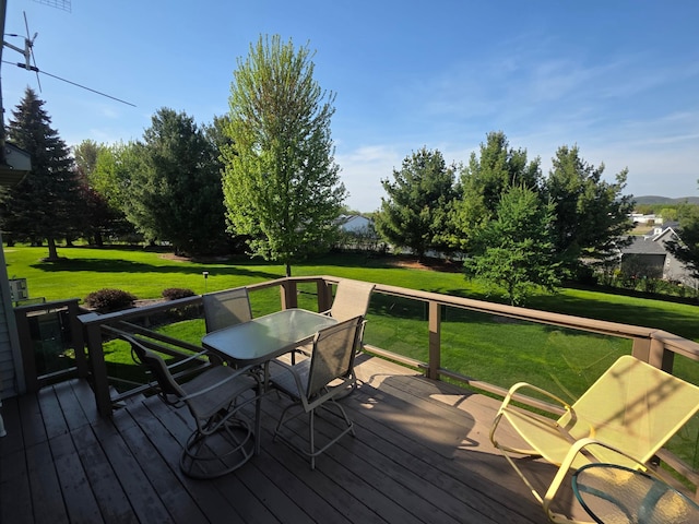 1073 Harvest Way, Lake City, MN 55041 - wooden terrace featuring outdoor dining space and a lawn