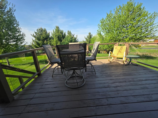1073 Harvest Way, Lake City, MN 55041 - wooden deck with outdoor dining area and a yard