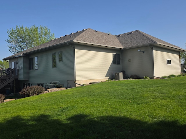 1073 Harvest Way, Lake City, MN 55041 - view of home's exterior featuring a yard, central AC unit, and roof with shingles