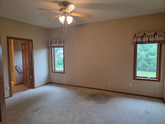 1073 Harvest Way, Lake City, MN 55041 - unfurnished room with plenty of natural light, light colored carpet, and a ceiling fan
