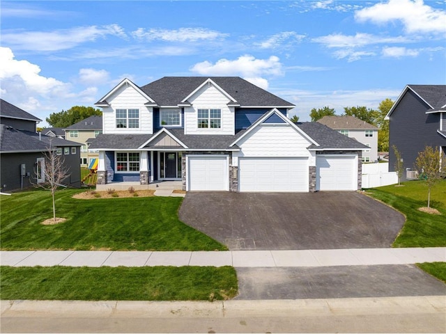view of front of house with asphalt driveway, stone siding, an attached garage, and central air condition unit
