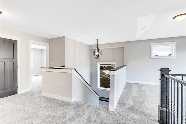 stairs featuring carpet and baseboards
