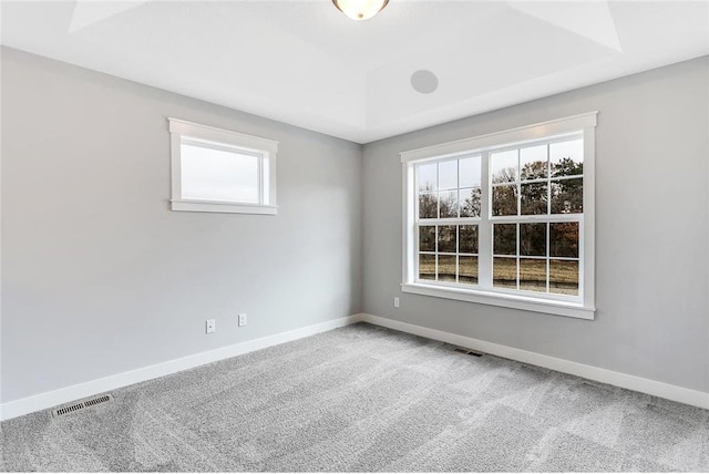 empty room with baseboards and carpet floors