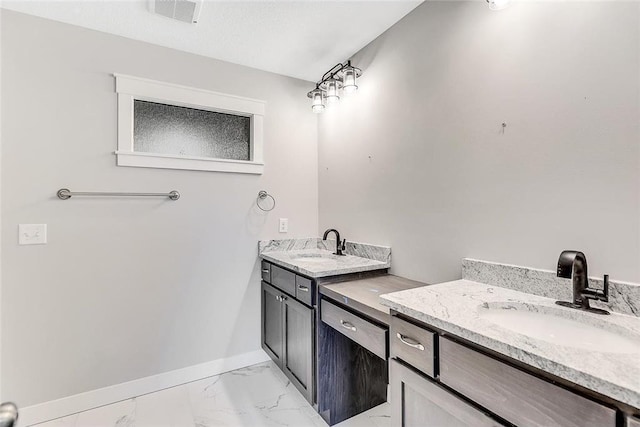 bathroom with vanity, baseboards, and marble look tile flooring