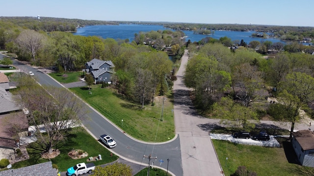 aerial view of property's location with a large body of water
